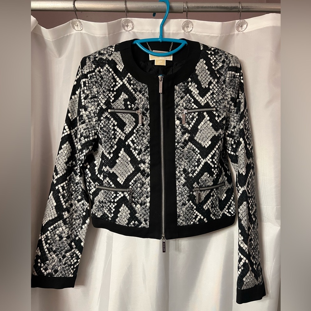 Michael Kors jacket. Very classy in black print with silver zippers size10P